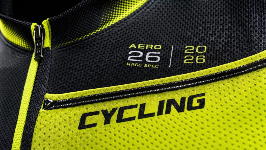 A premium 2026 cycling jersey fabric showing intricate high-tech textile weave pattern