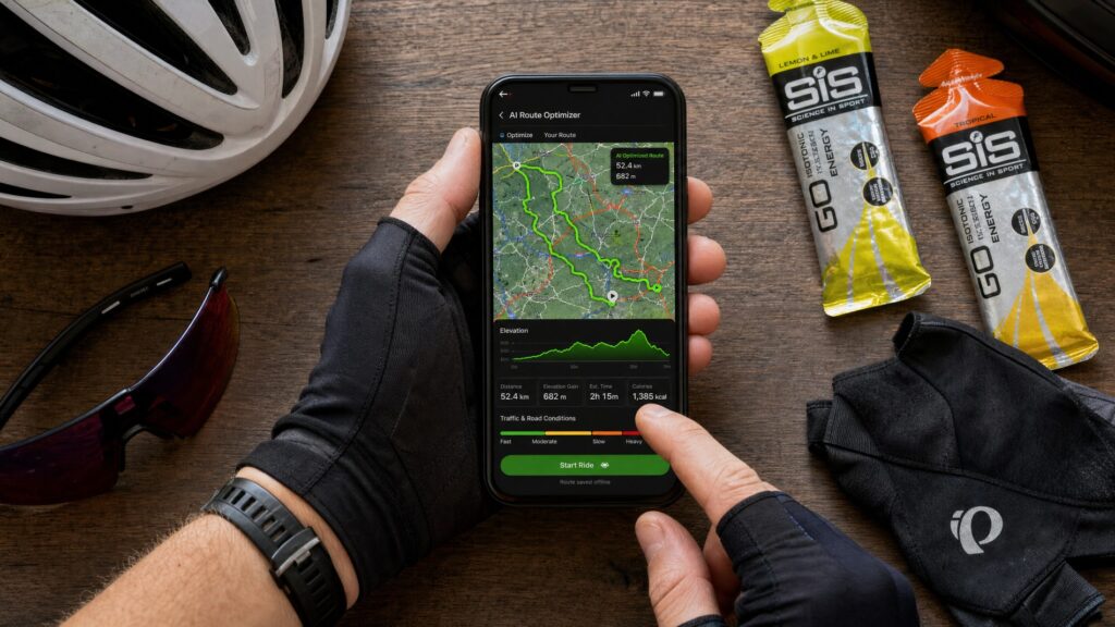 Cyclist using a smartphone showing an AI-powered cycling route planning app