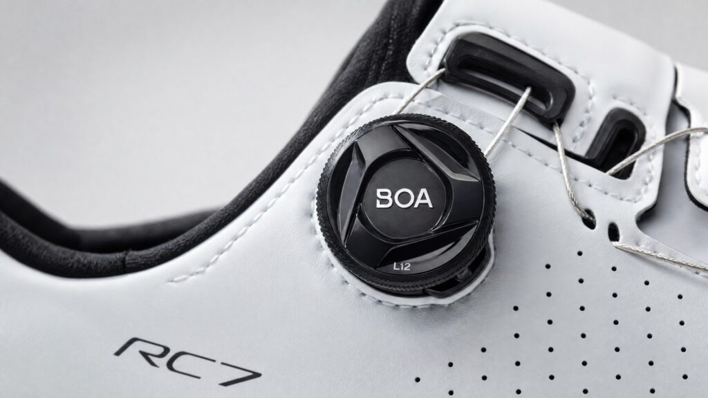 BOA dial closure system with wire lacing on a white premium road cycling shoe