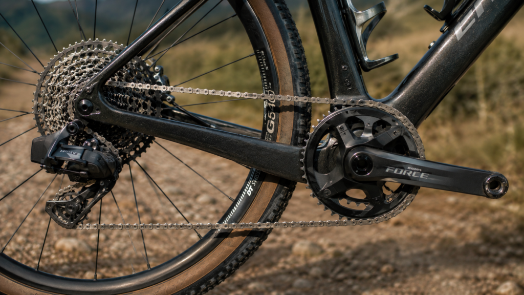 Close-up of 13-speed gravel bike drivetrain with chain and derailleur