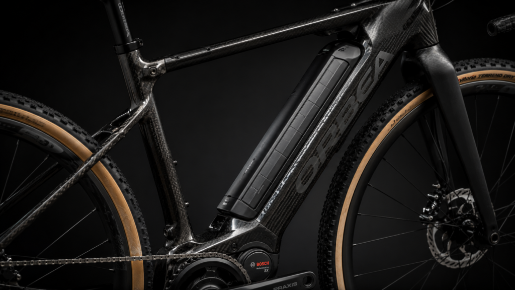 Close-up of carbon fiber e-gravel bike frame with integrated battery system